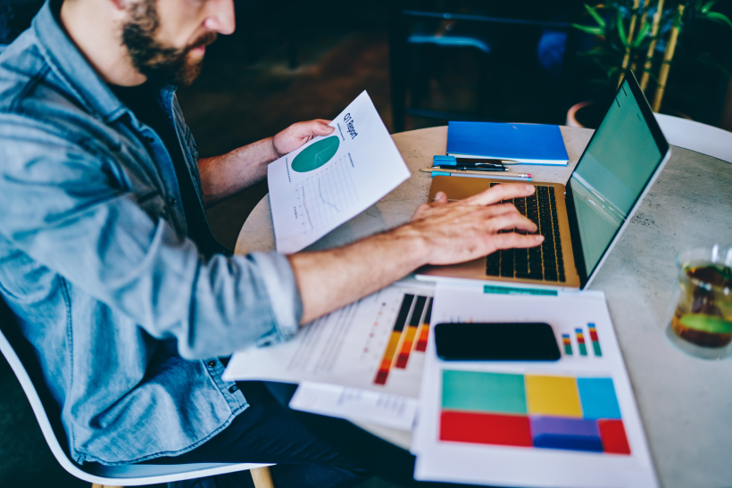 Man working on a laptop, analysing digital marketing data