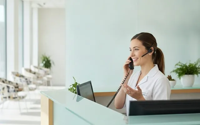 Clinic receptionist supported by an AI call center